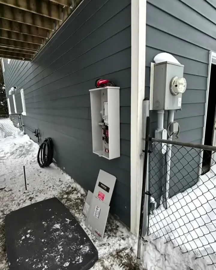 Generator connection and meter on the side of a Pike Bay home, 14 kW Generac install