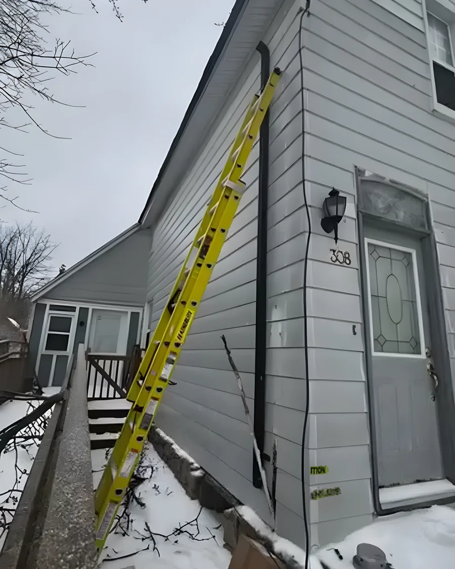 Ladder up at a Dundalk home to replace storm-damaged service equipment