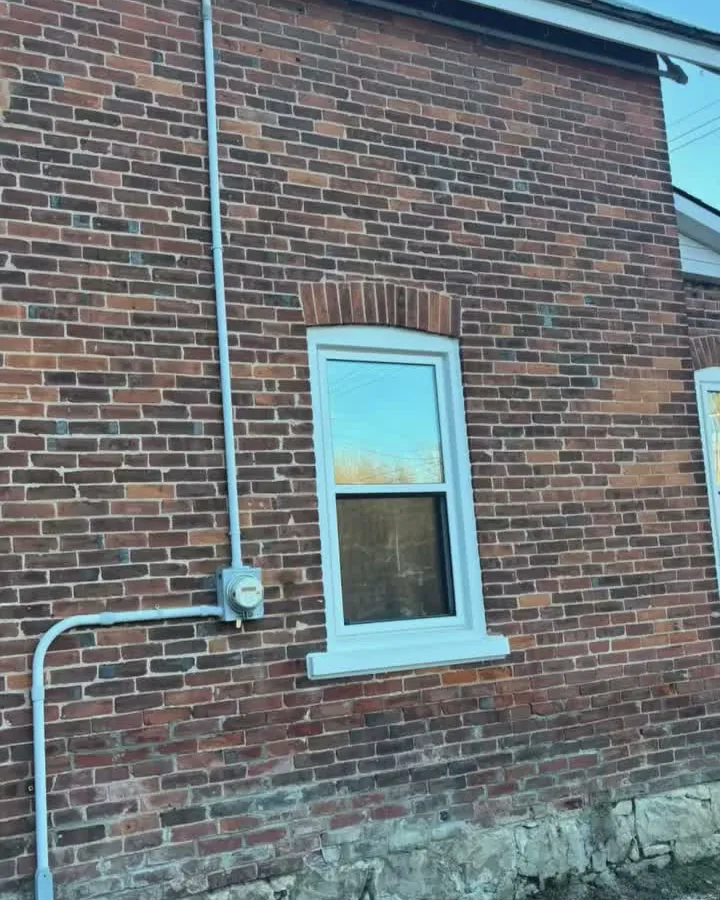 New 200 amp meter base on the brick wall of a Shallow Lake home