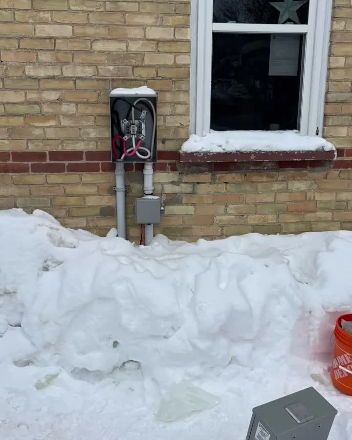 Meter base torn off a Wiarton home by ice sliding off the roof, before Dunne Power replaced it