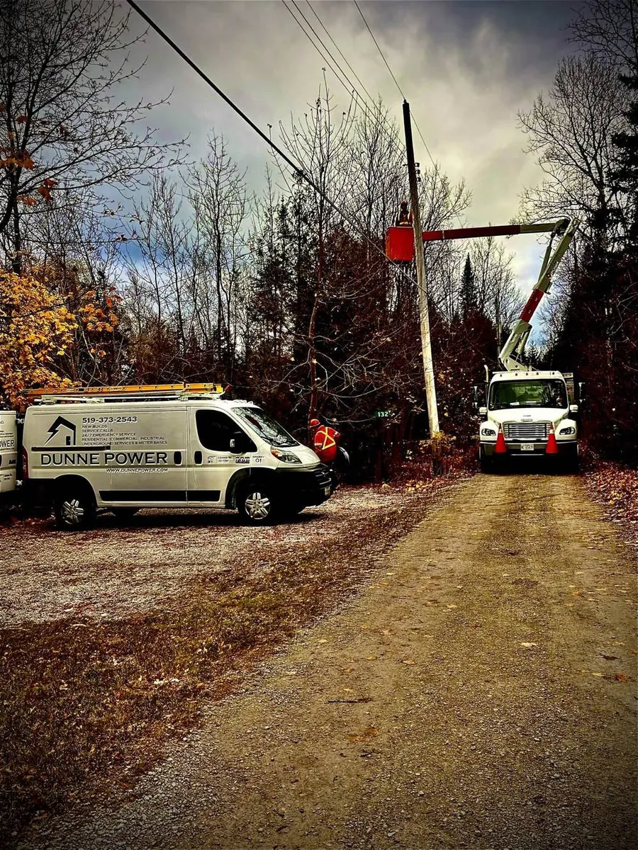 Dunne Power bucket trucks on a pole line job