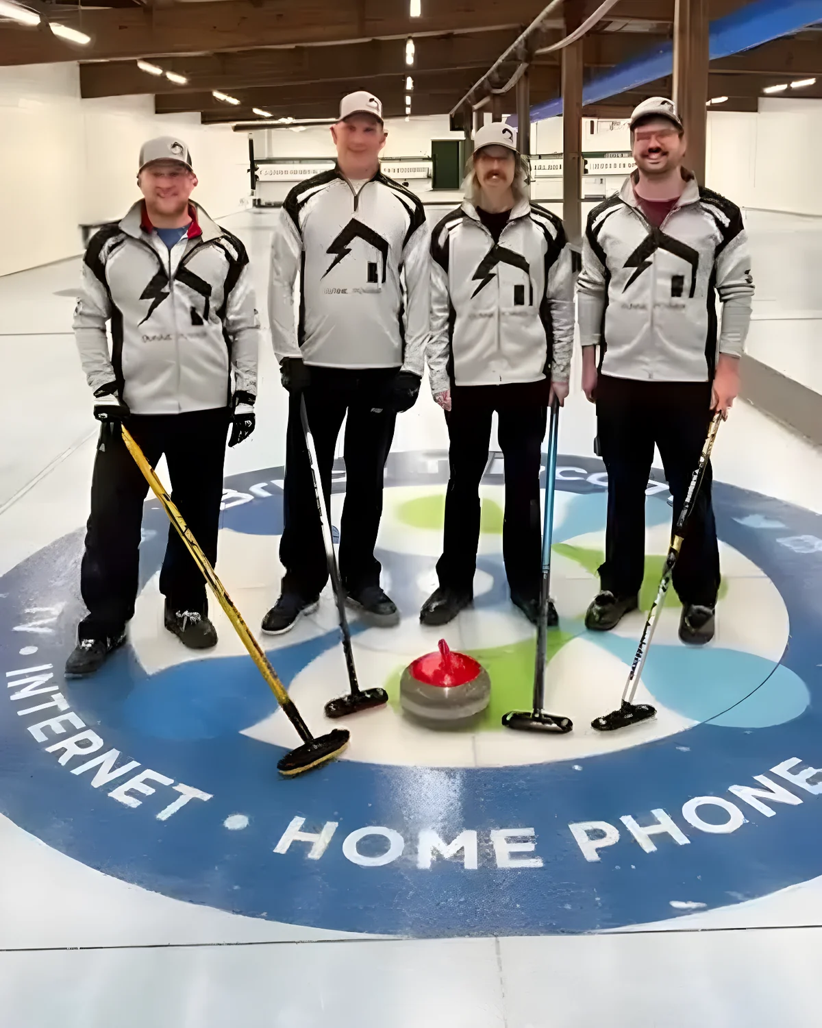 Team Coady in Dunne Power curling jackets on the ice